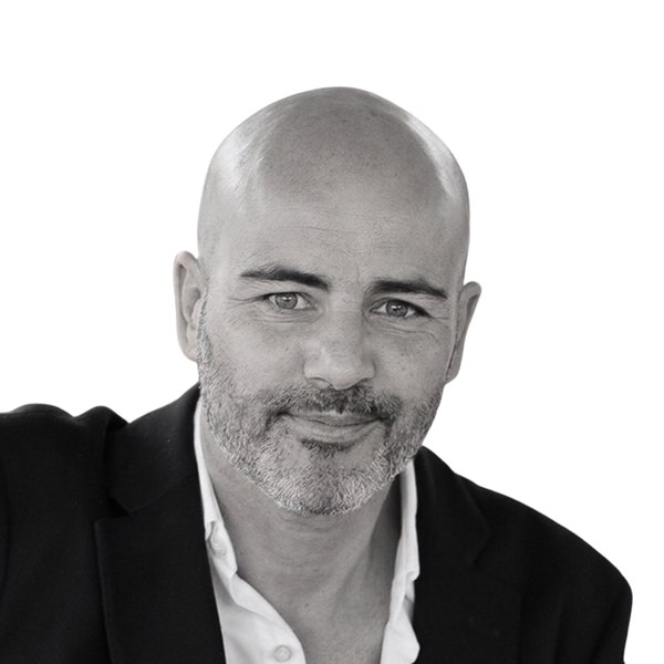 Elad Alon, black-and-white portrait: bald, grey beard, dark jacket and white shirt.